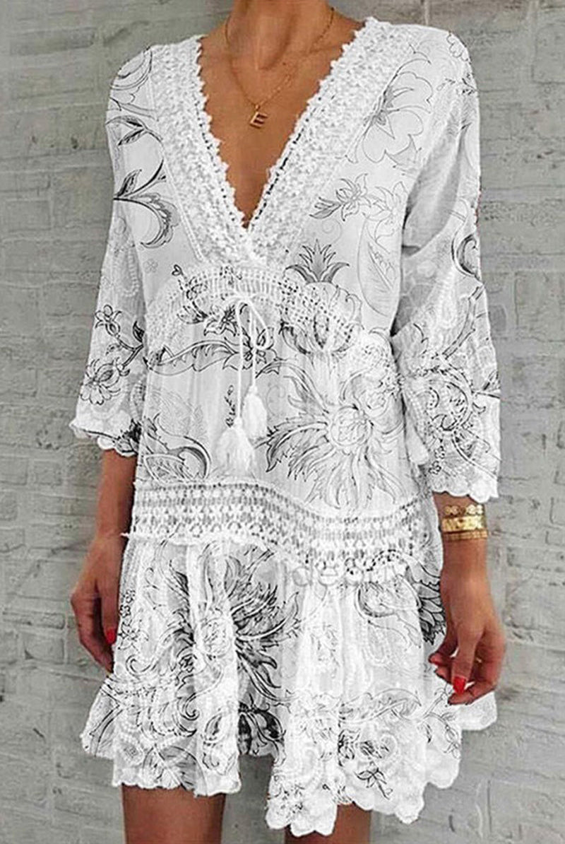 Red Nova boho mini dress with deep V-neck by Lumina Vancouver, featuring flowing fabric and casual style.