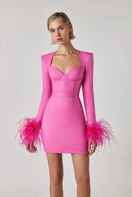 Black Nova mini cocktail dress by Lumina Wear, fitted silhouette with elegant design, displayed on a hanger.