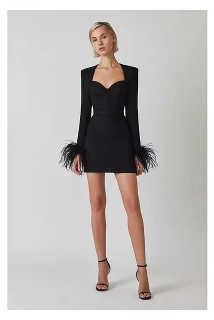 Black Nova cocktail mini dress by Lumina Vancouver, form-fitting with elegant design, perfect for evening events and parties.
