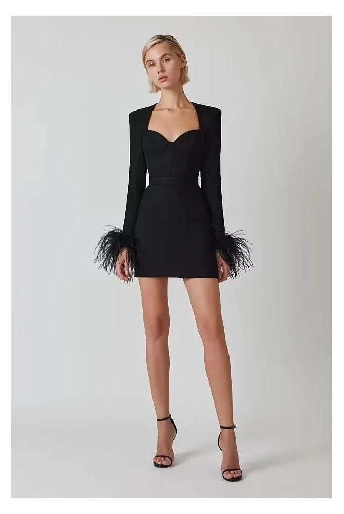 Black Nova mini cocktail dress by Lumina Vancouver, featuring a fitted silhouette and stylish design suitable for evening events.