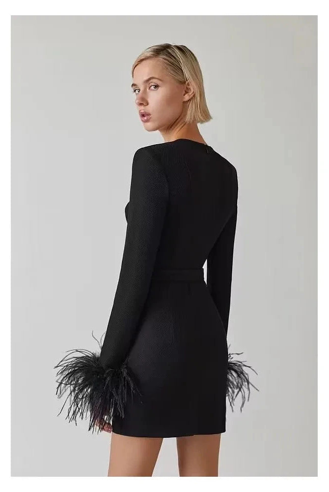 Black Nova mini cocktail dress by Lumina Wear, fitted style with elegant design, shown on a model.