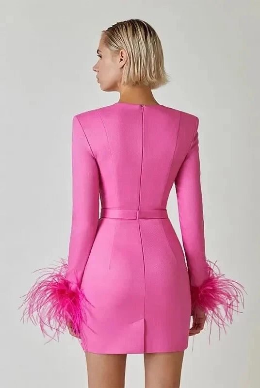 Black Nova mini cocktail dress by Lumina Wear featuring a fitted silhouette and elegant design, displayed on a hanger.