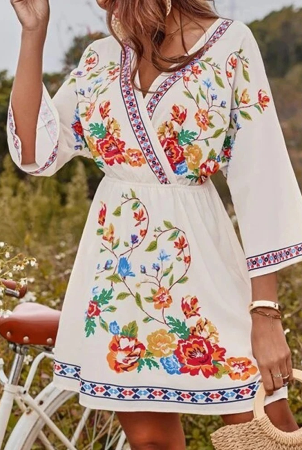 Floral print V-neck mini dress by Lumina Wear featuring pink and red fresh flower patterns, fitted waist, and short hemline.