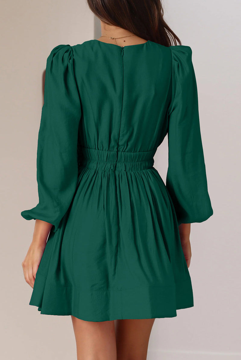 Black Nova mini dress by Lumina Vancouver featuring a V-neck and puff sleeves, shown on a model.