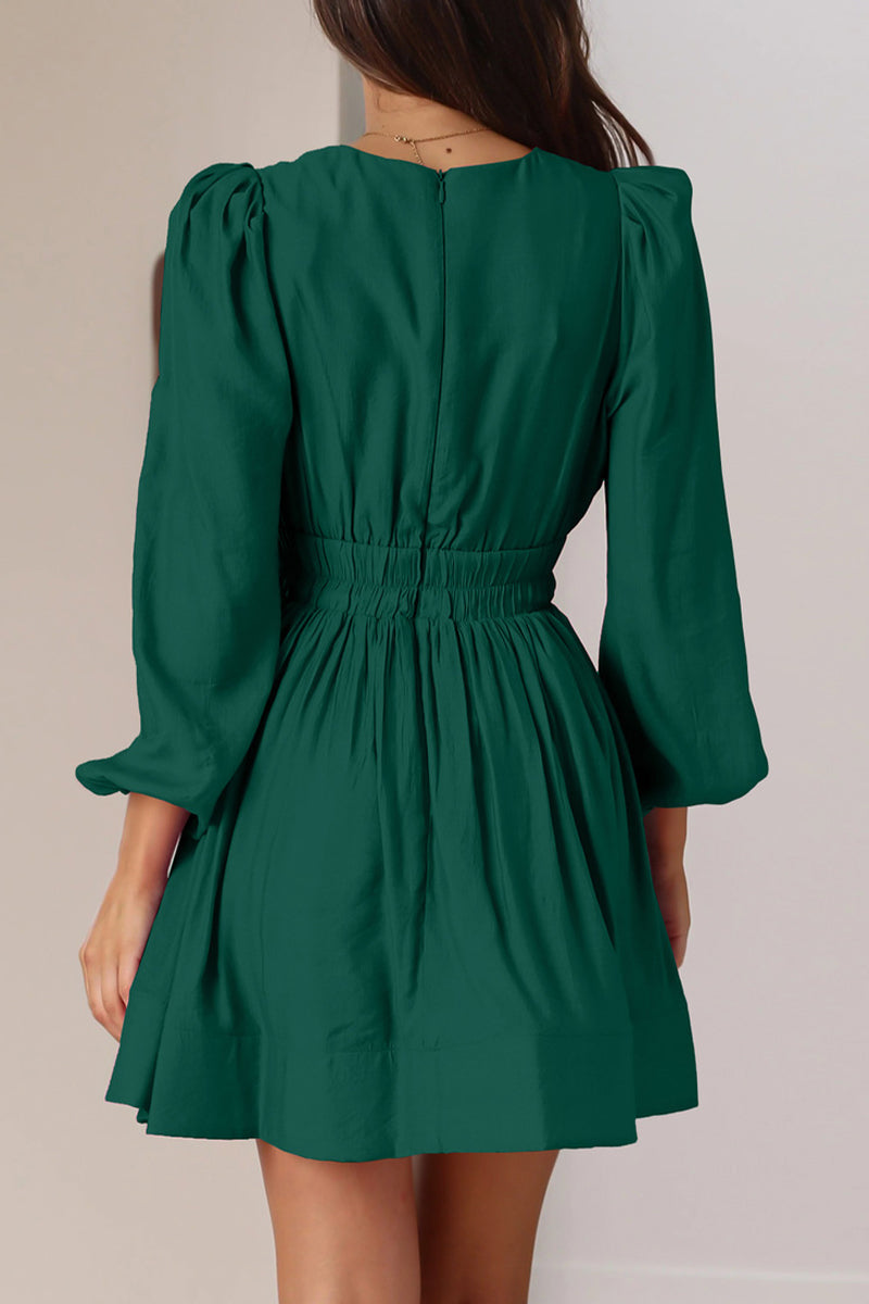 Black Nova mini dress by Lumina Vancouver featuring a V-neck and puff sleeves, shown on a model.