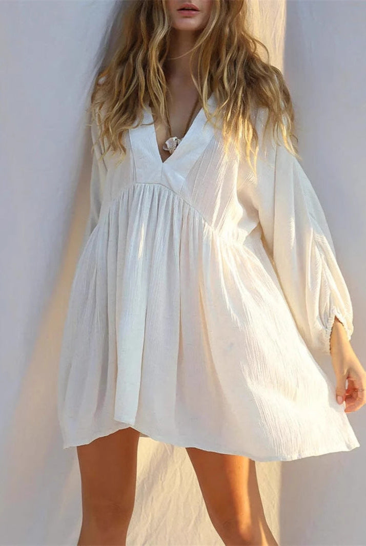 Lumina Vancouver Jacinta mini dress with sheer V-neck in white, featuring a stylish, fitted silhouette for a chic look.
