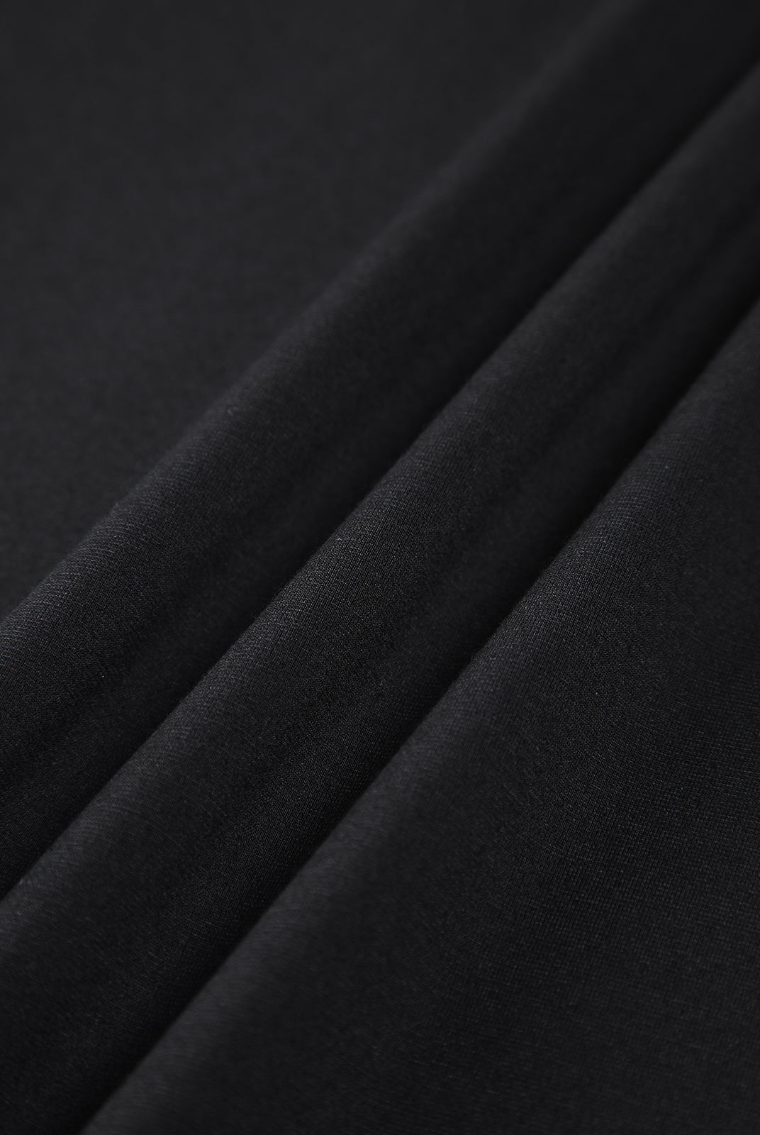 Black Nova off-shoulder bodycon mini dress by Lumina Vancouver, fitted silhouette, stylish evening wear for women.