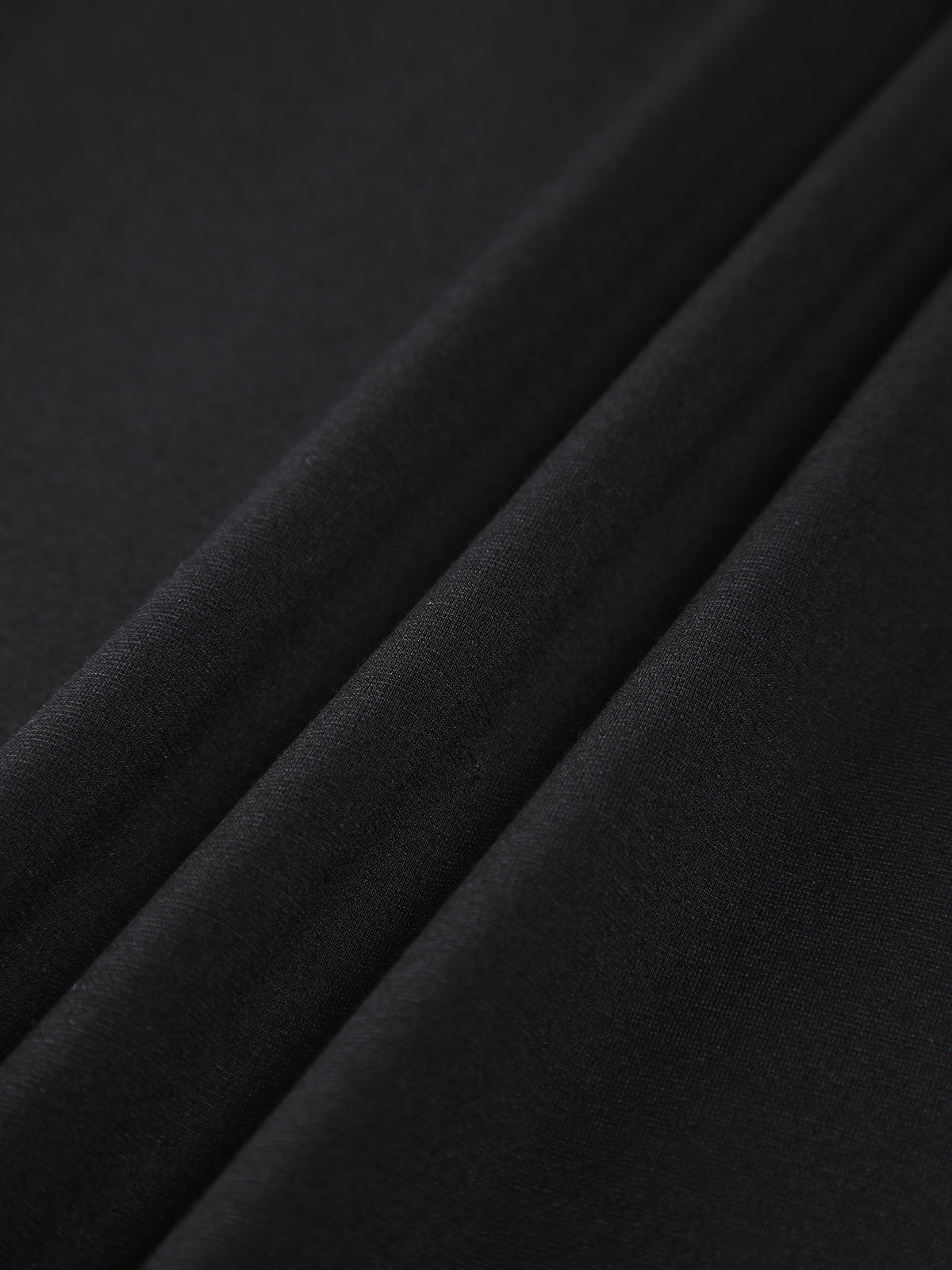 Black Nova off-shoulder bodycon mini dress by Lumina Vancouver, fitted silhouette, stylish evening wear for women.