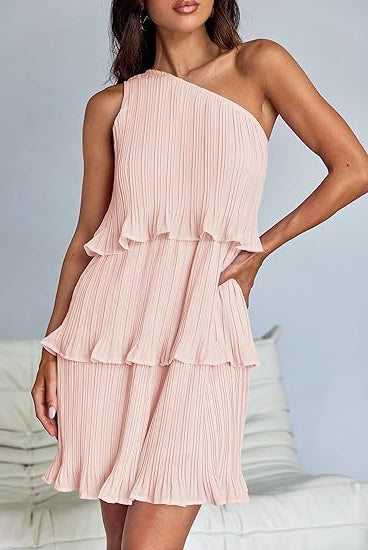 White Nova pleated one-shoulder mini dress by Lumina Vancouver, featuring elegant draping and a modern silhouette.