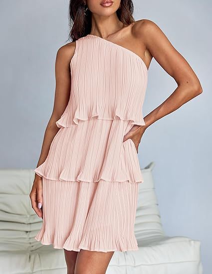 White Nova pleated one-shoulder mini dress by Lumina Vancouver, featuring elegant draping and a modern silhouette.