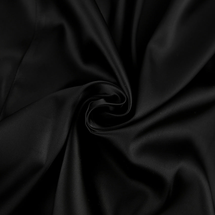 Black Vesna satin mini dress by Lumina Vancouver, form-fitting style, shown on a model with a sleek, elegant look.