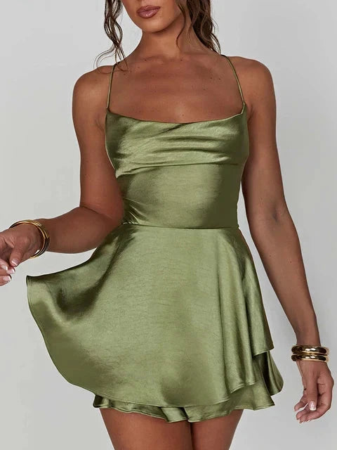 Green satin mini dress with cowl neck by Lumina Vancouver, featuring a sleek, fitted silhouette and elegant design.