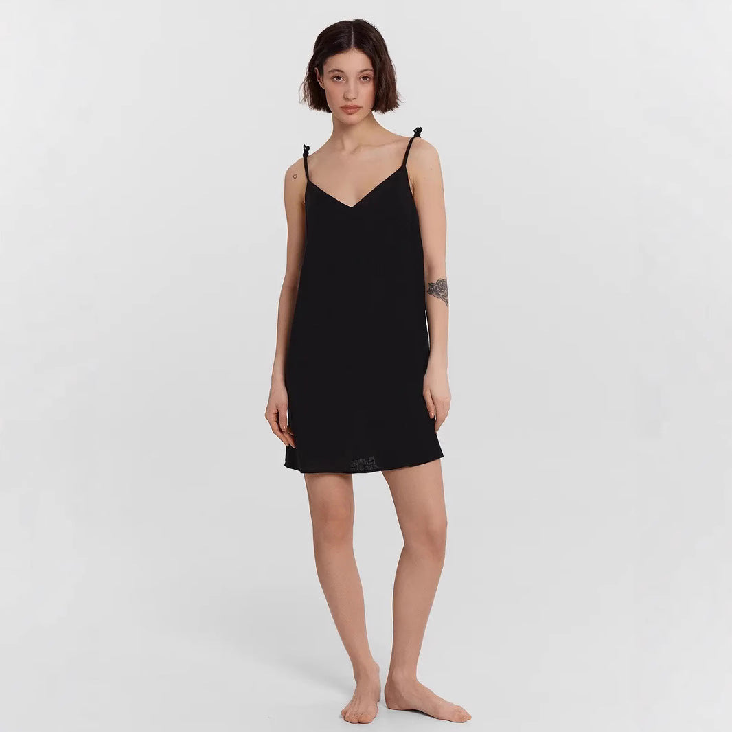 Black Carys satin slip dress by Lumina Vancouver, mini dress style, showing smooth satin fabric and fitted design.