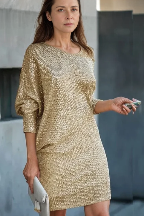 Black Olwen sequin mini dress with round neckline by Lumina Wear, featuring shimmering embellishments and fitted silhouette.
