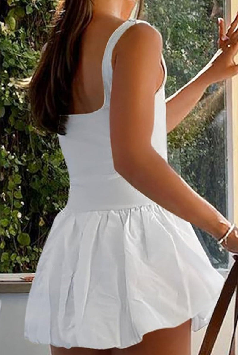 White Nova Lumina sleeveless bubble hem mini dress displayed on a hanger, showcasing its stylish design and fitted silhouette.