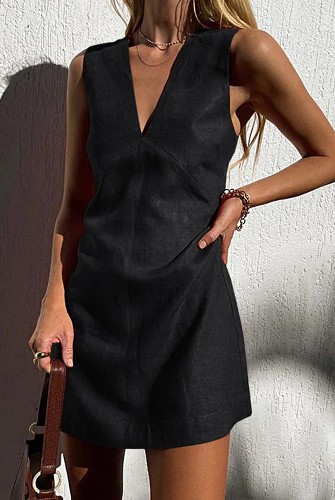 Red linen-blend sleeveless V-neck mini dress by Lumina Wear, shown on a model, featuring a stylish V neckline and mini length.