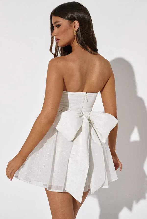 Red strapless mini dress with A-line silhouette and tulle fabric by Lumina Wear, styled for a chic, elegant look.