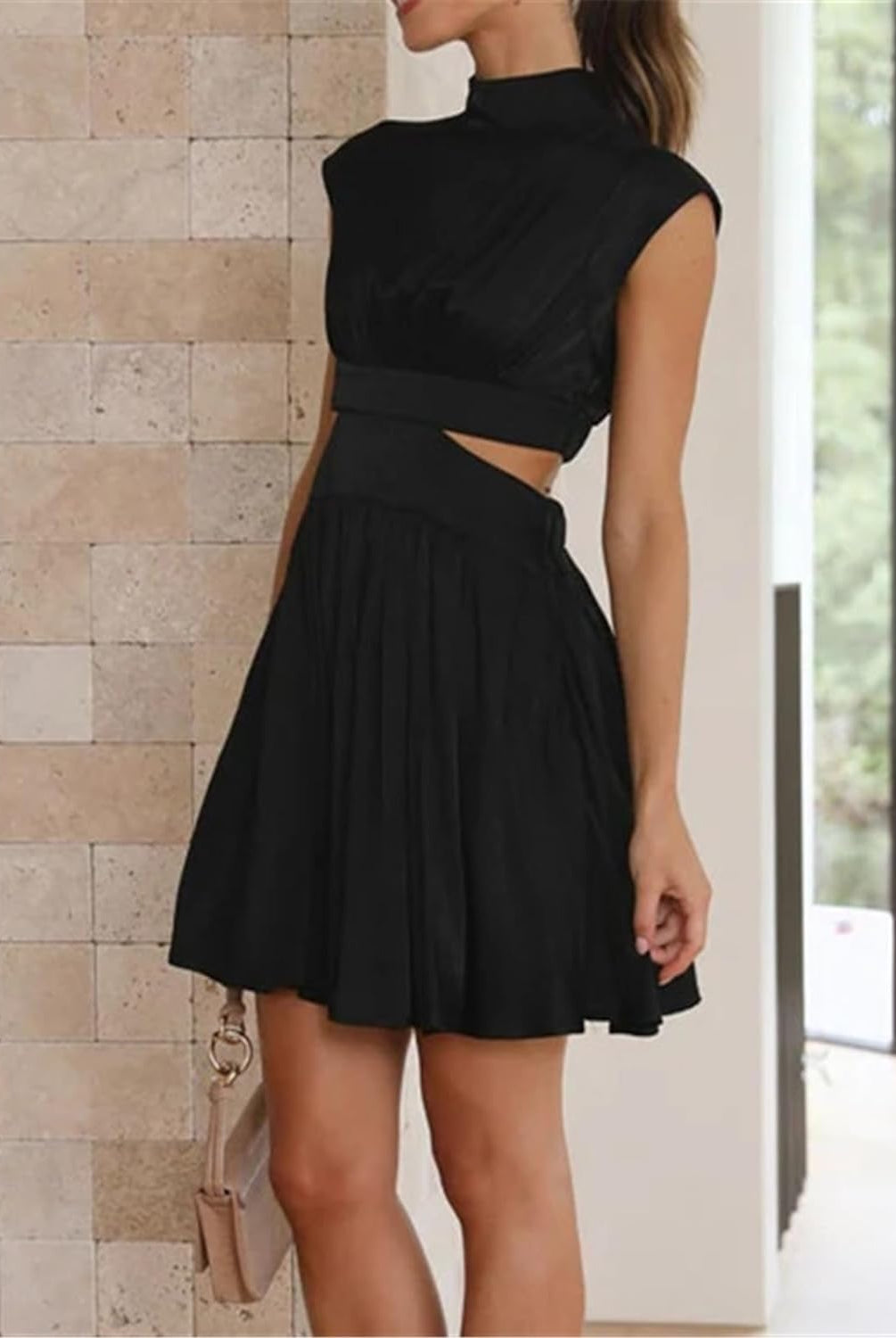 Black Nova two-piece sleeveless mini dress by Lumina Vancouver, featuring a stylish, fitted silhouette and modern design.