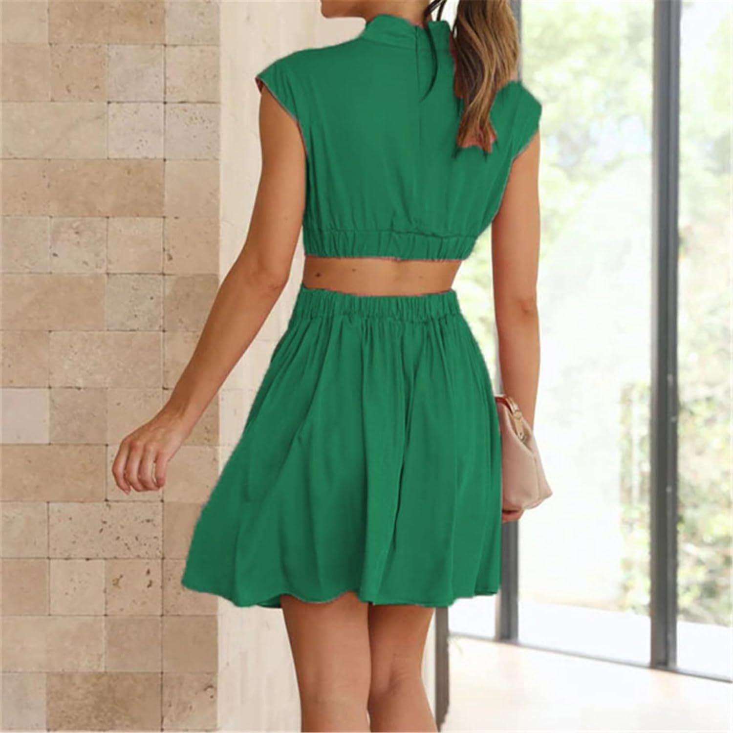 Black Nova two-piece sleeveless outfit by Lumina Vancouver, featuring a stylish mini dress design.