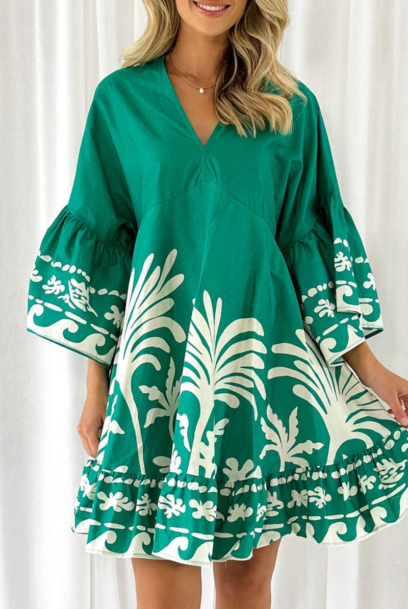 Lumina Vancouver Nova V-Neck A-Line Boho Print Mini Dress in green, showcasing a stylish and comfortable design.