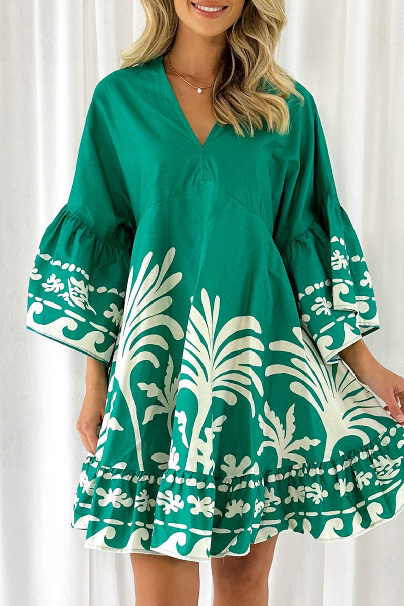 Lumina Vancouver Nova V-Neck A-Line Boho Print Mini Dress in green, showcasing a stylish and comfortable design.