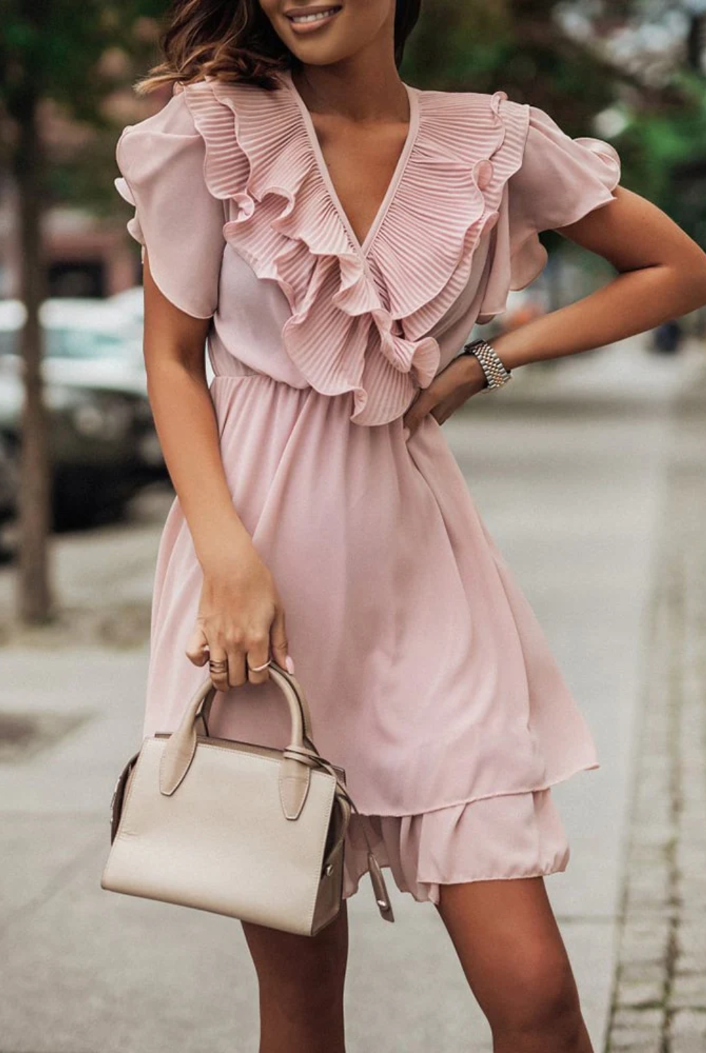 Pink Maren V-neck mini dress with tiered design by Lumina Wear, shown on a model.