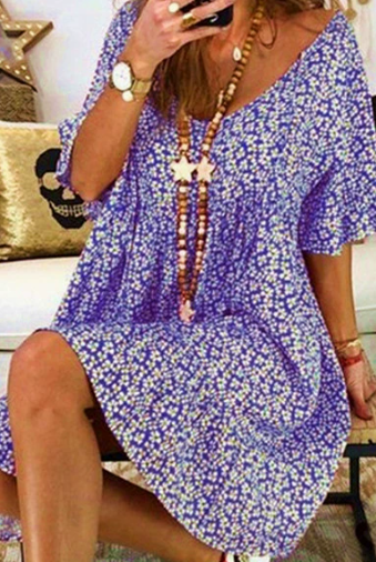 Black Nova V-neck tassel detail mini dress by Lumina Vancouver, showcasing its stylish neckline and tassel accents.