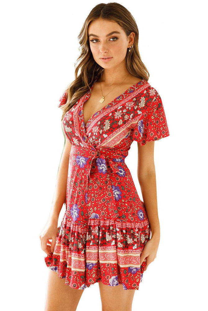 Red floral Nova wrap dress by Lumina Vancouver, short sleeve mini dress with a flattering fit and vibrant print.