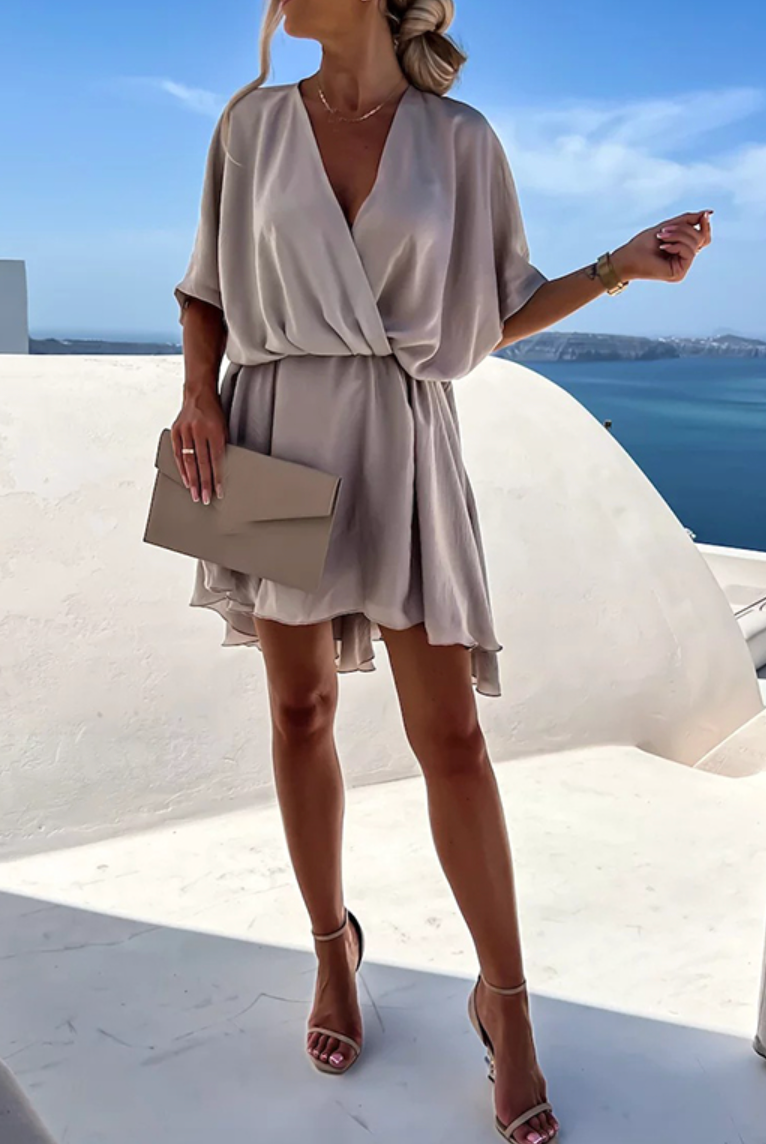 Pink Nova Wrap Dress by Lumina Wear with V-neck and short sleeves, stylish mini dress perfect for casual or semi-formal wear.