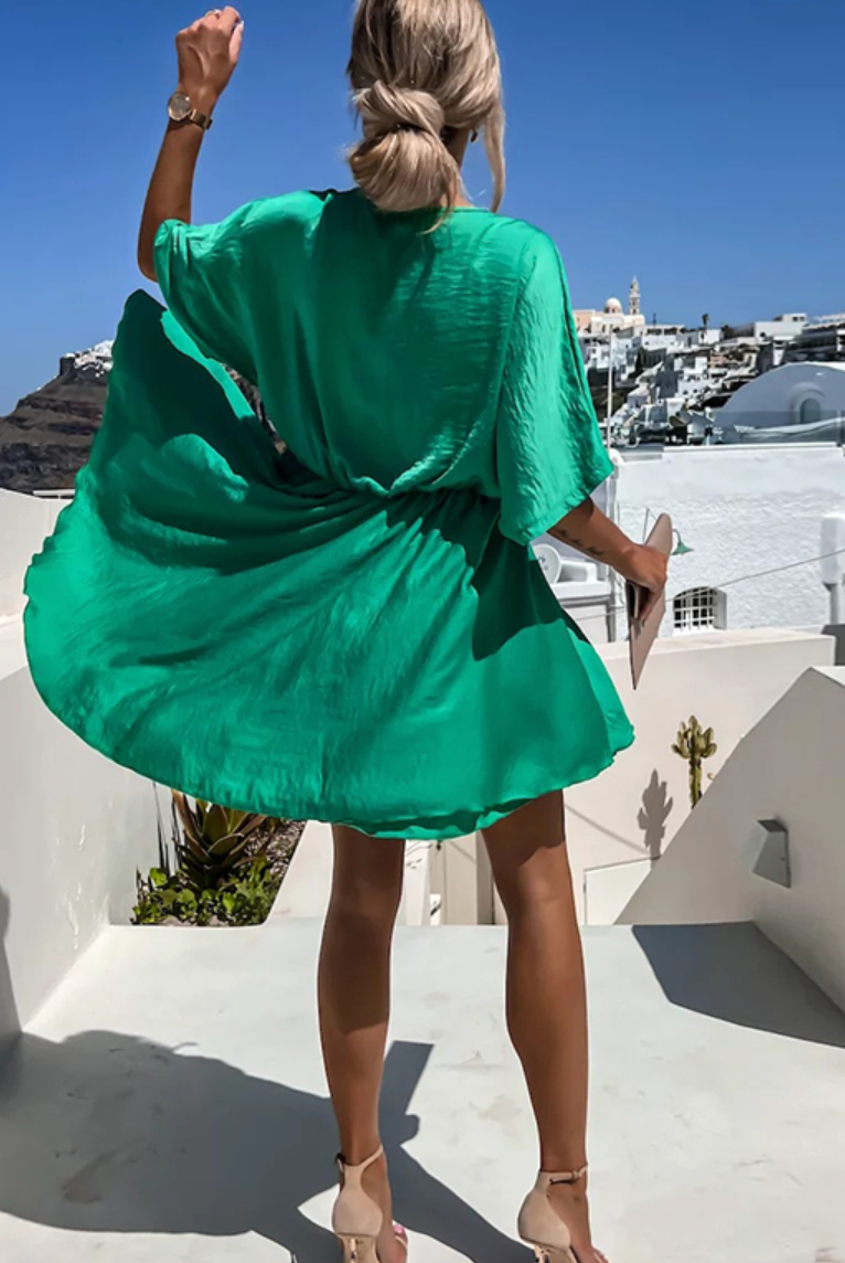 Lumina Wear Nova pink wrap dress with V-neck and short sleeves, stylish mini dress perfect for casual or dressy occasions.