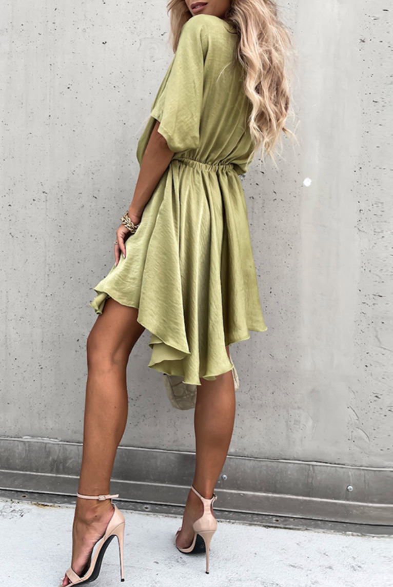 Pink Nova Wrap Dress by Lumina Wear featuring a V-neck and short sleeves, perfect for casual or semi-formal occasions.