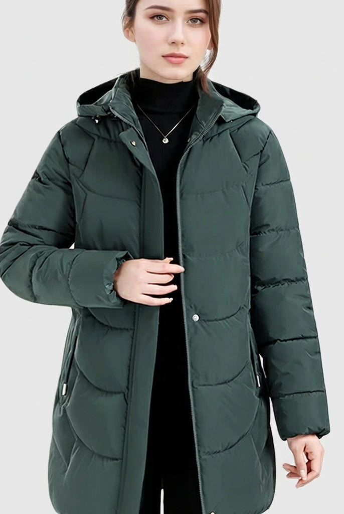 Women's Lumina Wear Olivia cozy longline hooded puffer coat with quilted design in dark green, featuring a warm, stylish fit.