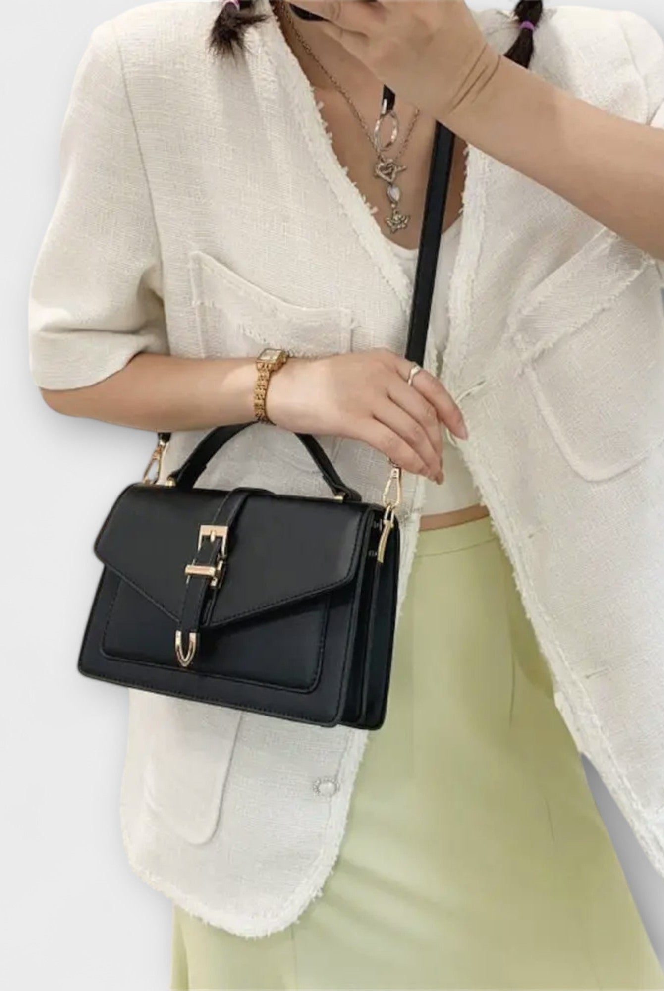 Olivia Lumina mini satchel handbag in khaki with timeless buckle detail, compact size, and elegant design.