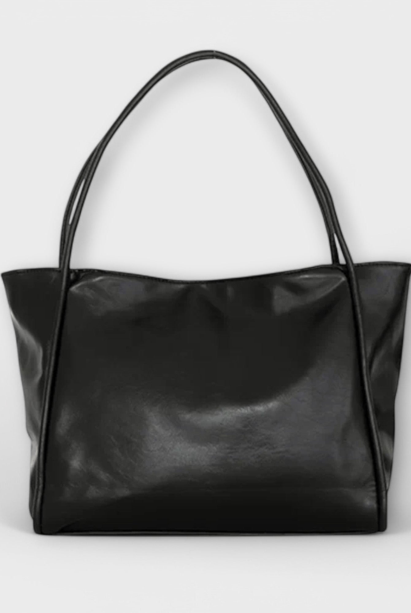Black Olivia Lumina tote bag with a minimalist design and spacious interior, perfect for everyday use.