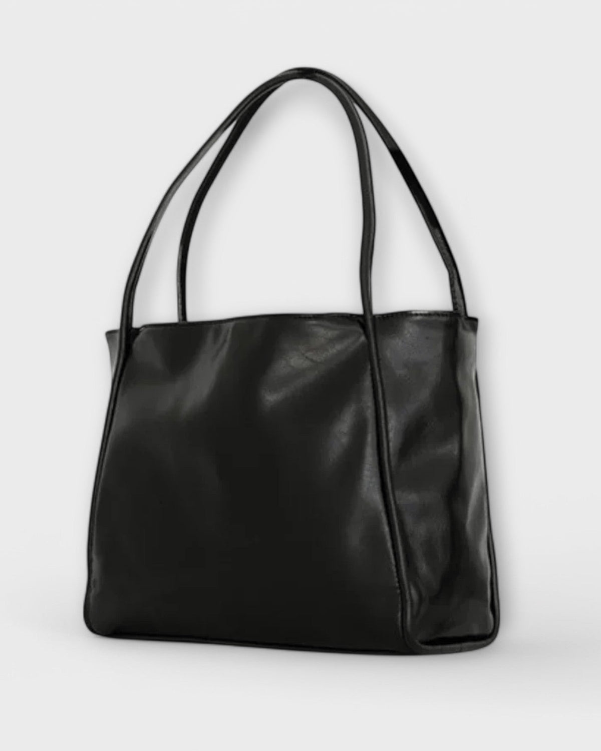 Black Lumina Wear Olivia minimalist tote handbag with spacious interior and sleek design, perfect for everyday use.