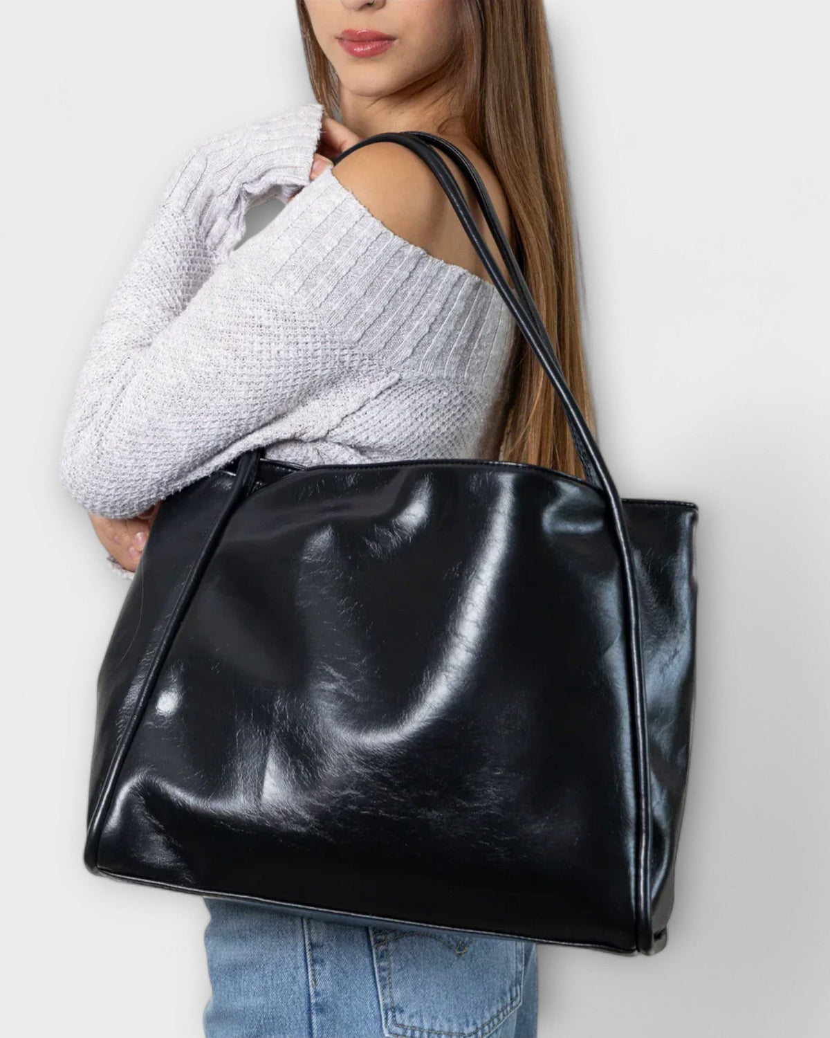 Black Olivia minimalist tote handbag by Lumina Wear featuring a spacious design and sleek, timeless style.