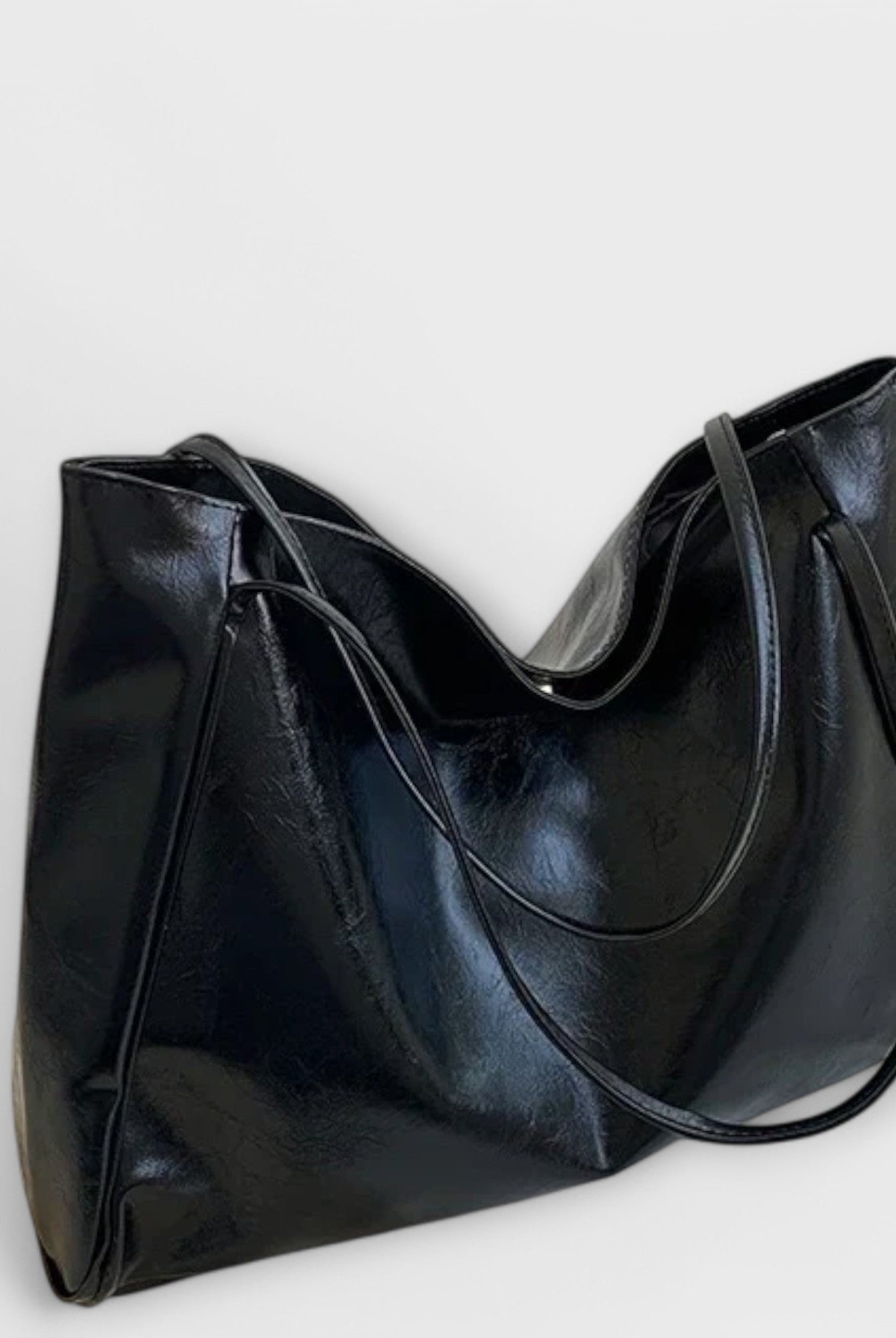 Black Olivia tote bag by Lumina Wear, minimalist design with spacious interior, perfect for everyday use.