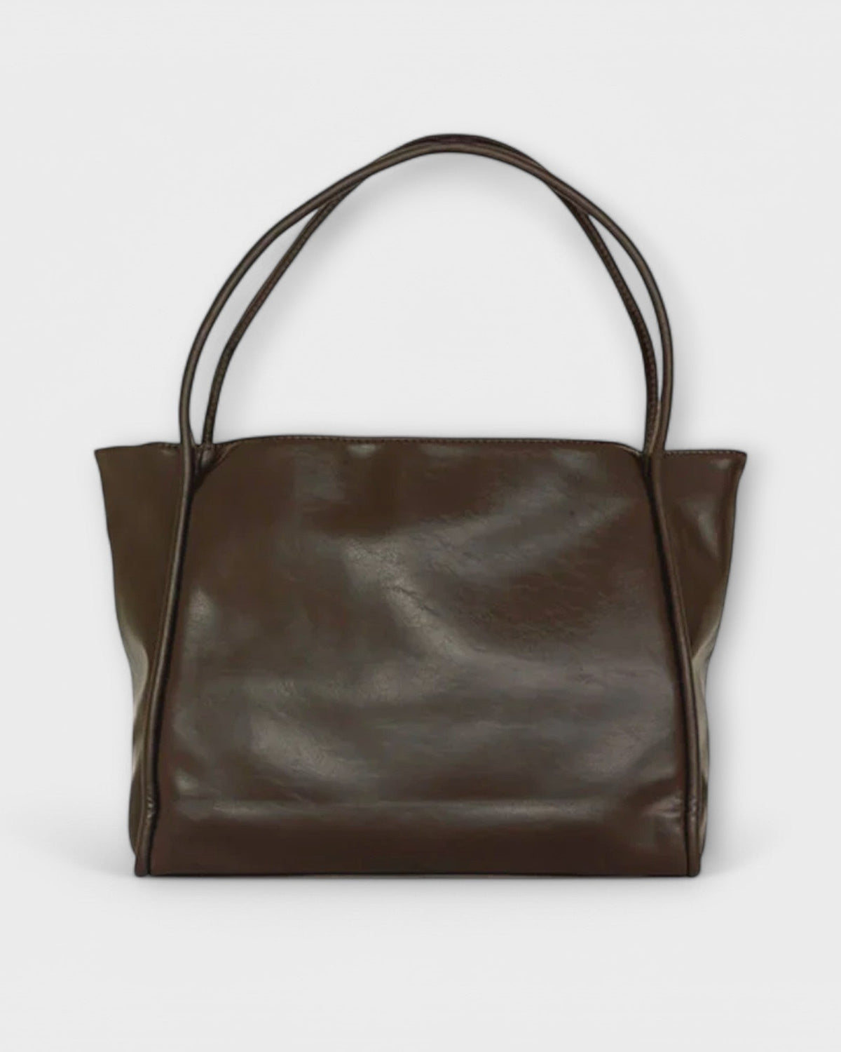 Black Lumina Wear Olivia tote bag featuring a minimalist design and spacious interior for everyday carry.