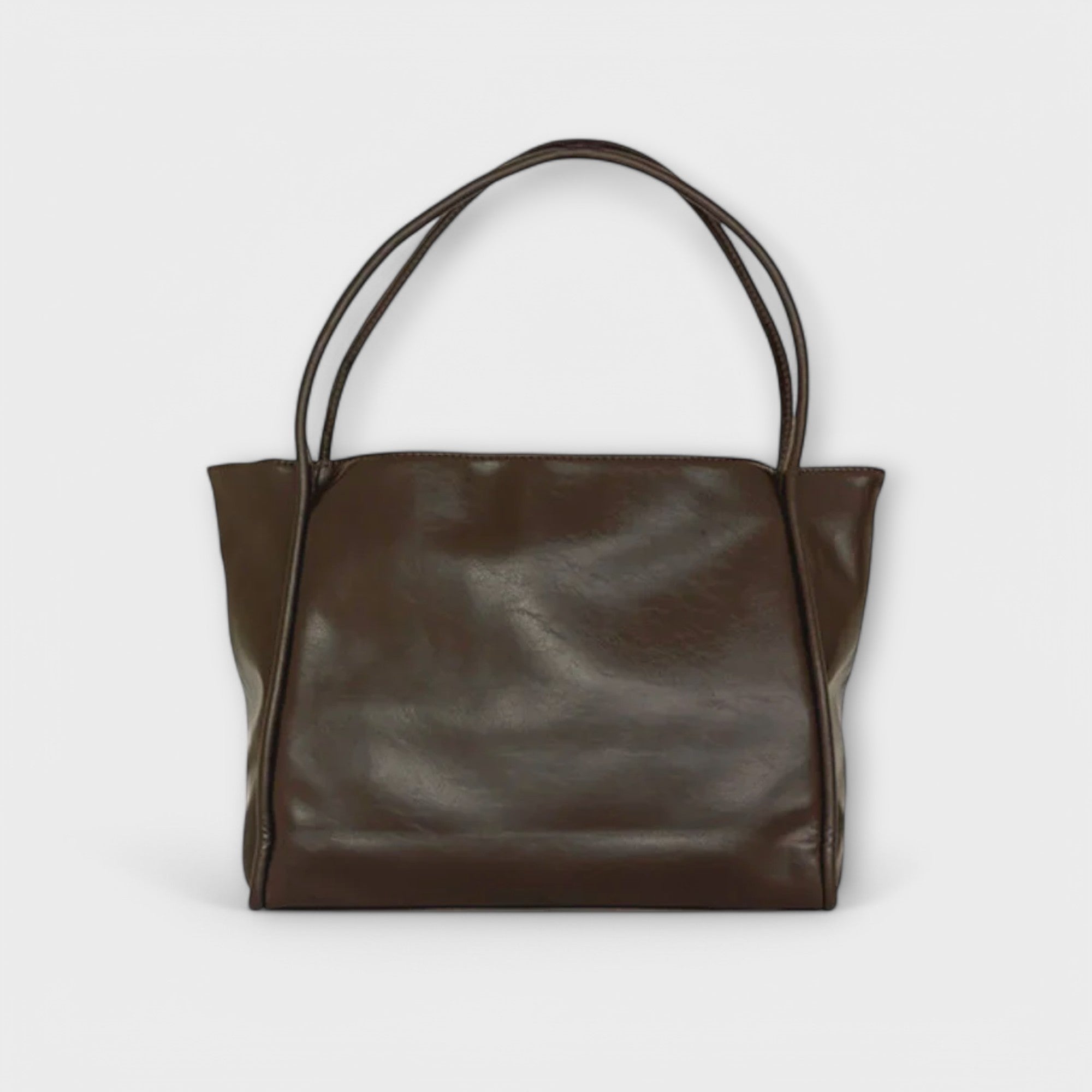 Black Olivia tote bag by Lumina Wear, minimalist design with spacious interior, casual and versatile tote for daily use.