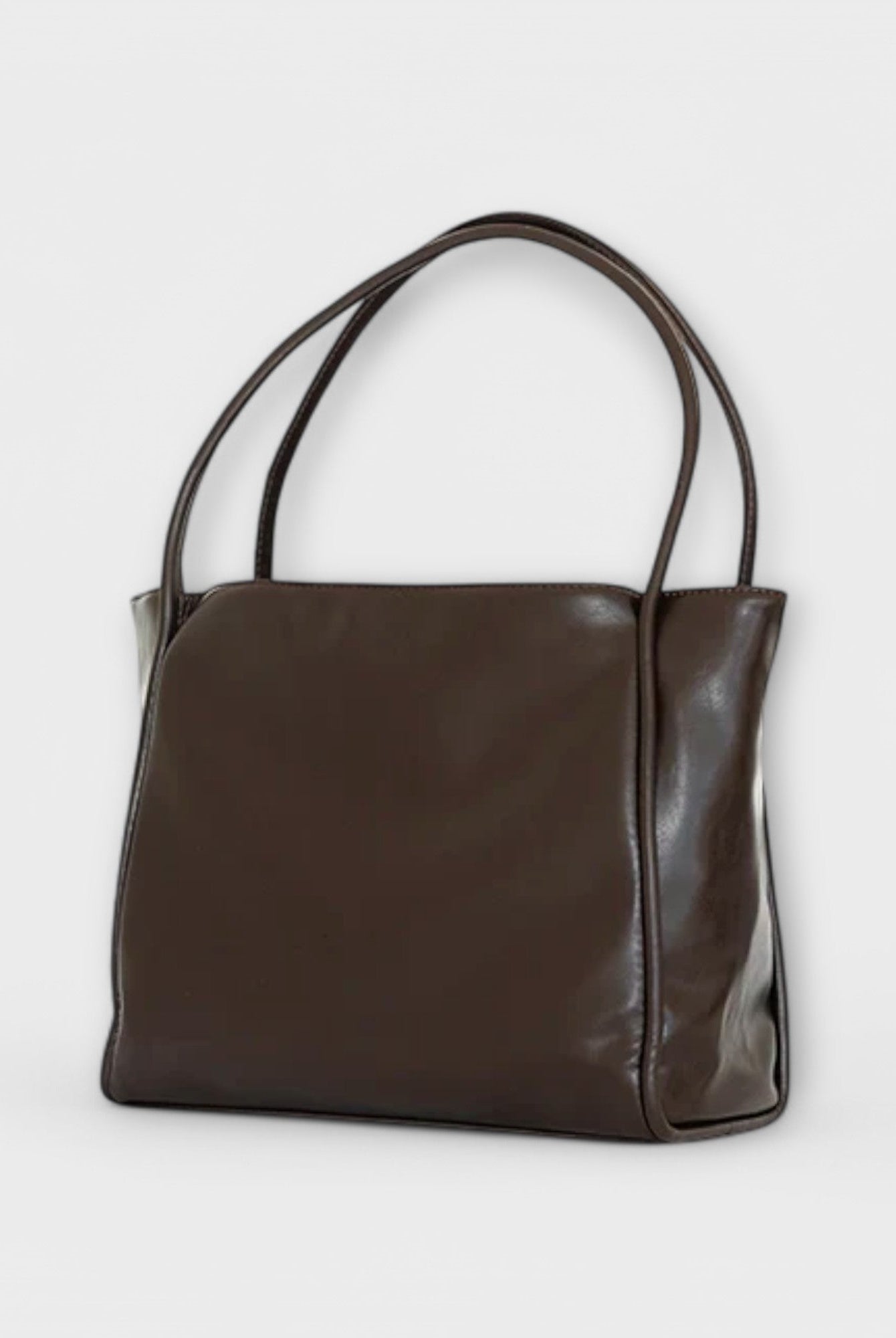 Black Olivia tote bag by Lumina Wear featuring a minimalist design and spacious interior, perfect for everyday use.