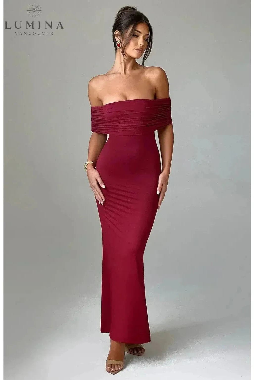 Black Olympia backless maxi dress by Lumina Wear, elegant floor-length style perfect for weddings and special occasions.