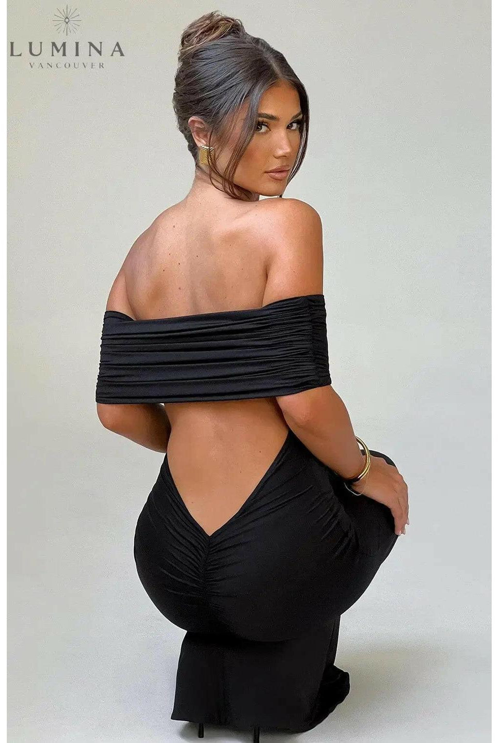 Black Olympia Elegant Backless Maxi Dress by Lumina Wear, flowing fabric, fitted bodice, perfect for wedding guests and formal events.
