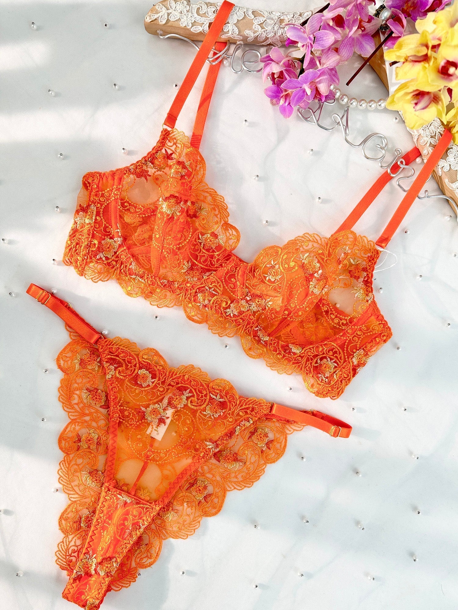 Orange floral embroidery lingerie set, 2-piece by Lumina Vancouver, featuring delicate floral embroidery and matching bra and panty.