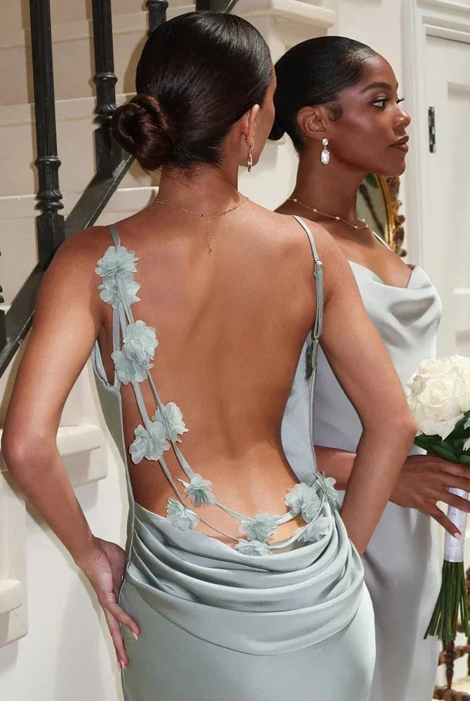 Light green Pauline backless maxi dress by Lumina Wear, elegant and sultry, flowing fabric with a fitted waist and floor-length design.