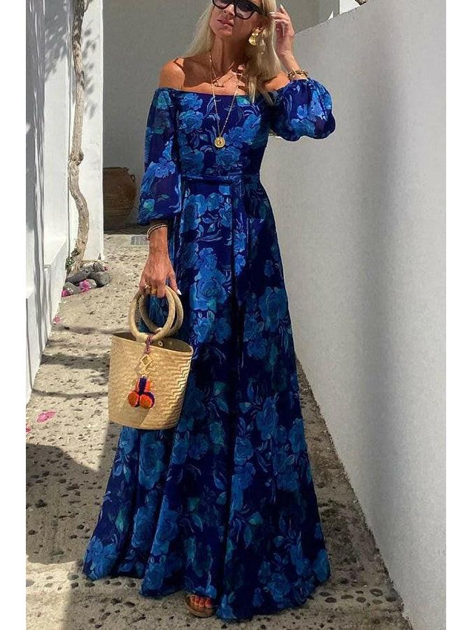 Blue Penelope Floral Off-Shoulder Maxi Dress by Lumina Vancouver, showcasing a flowy design with vibrant floral patterns.