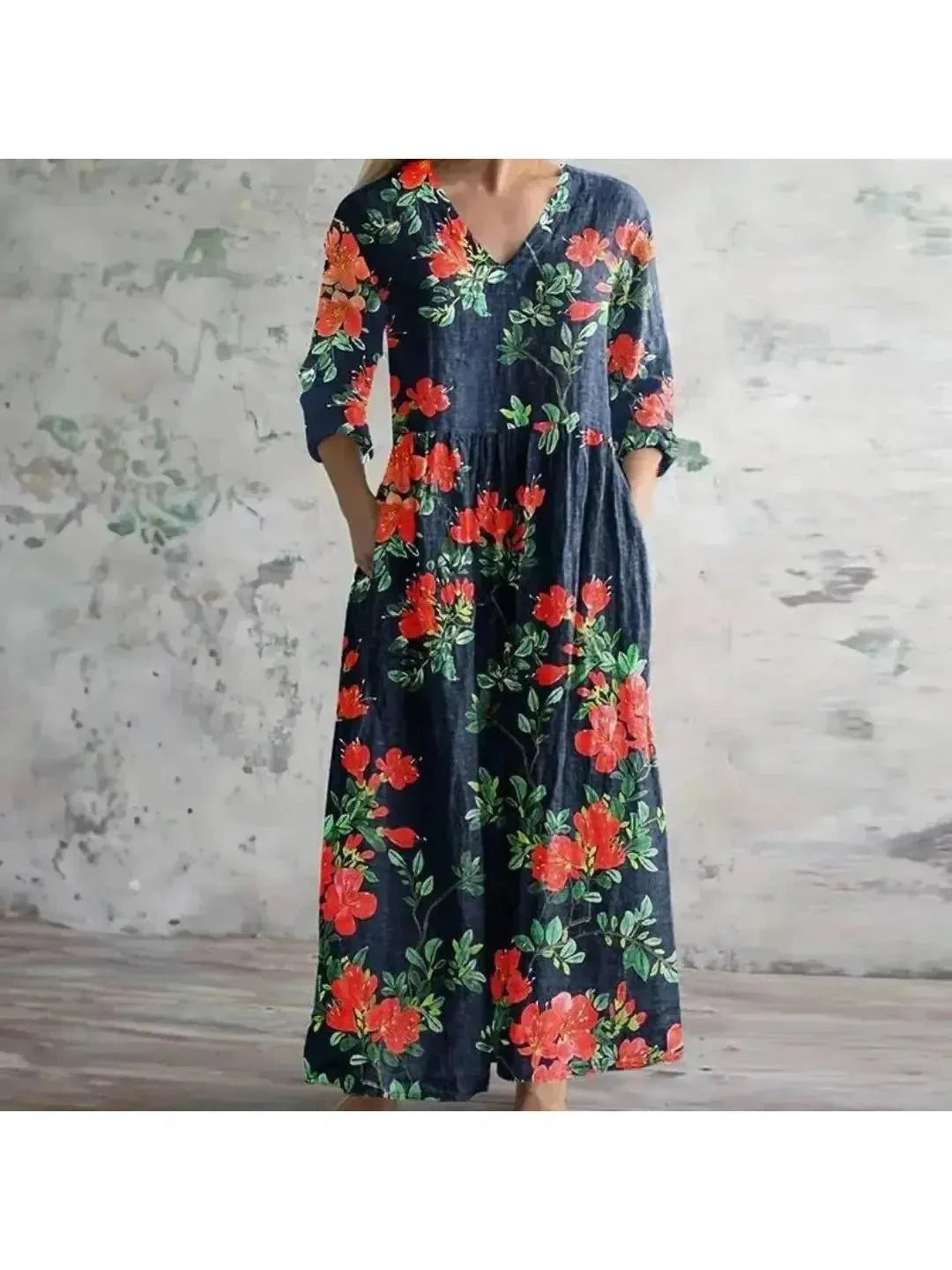 Polly retro maxi dress by Lumina Vancouver featuring vibrant multi-colored floral patterns in red and blue.
