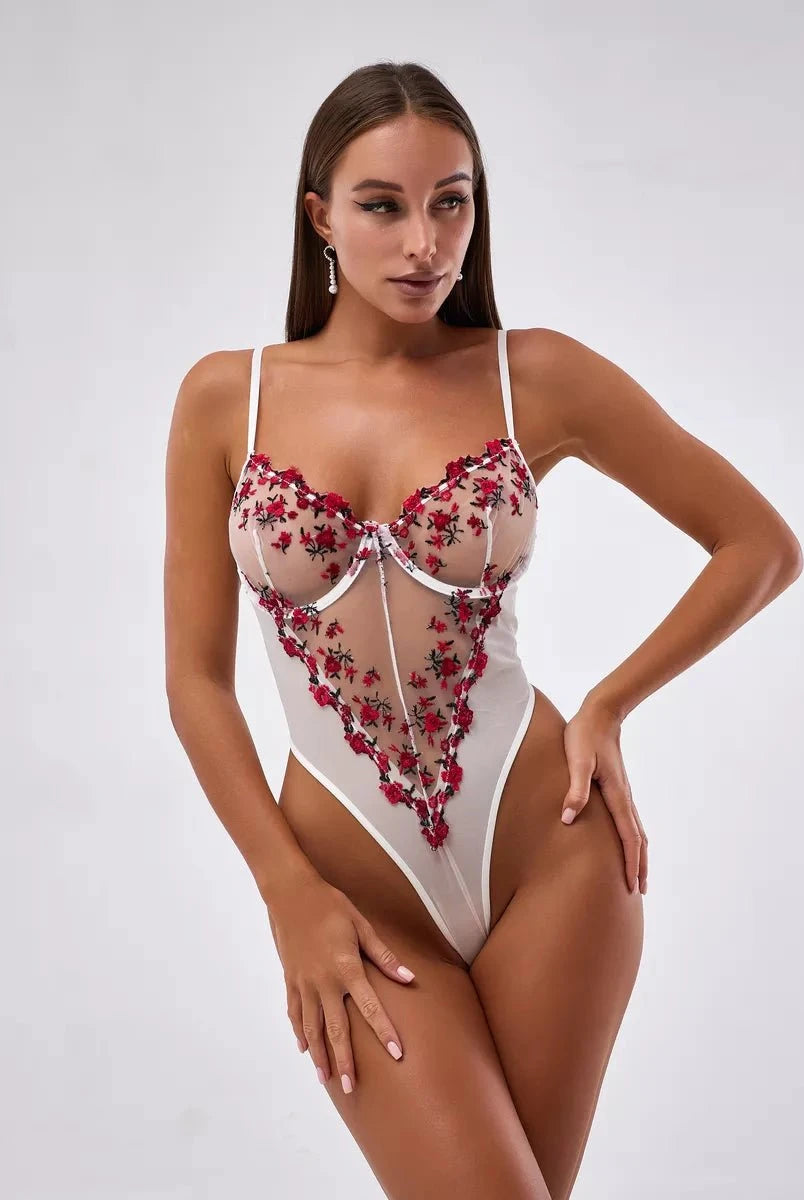Lumina Wear Priya Lace Bodysuit in size S, featuring intricate lace details and a fitted design, displayed on a model.