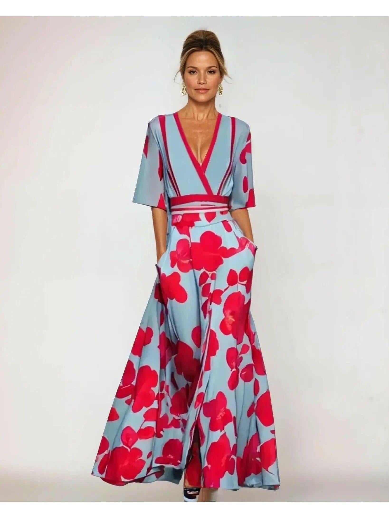 Red floral maxi dress by Lumina Vancouver featuring a flowing silhouette and vibrant floral pattern.