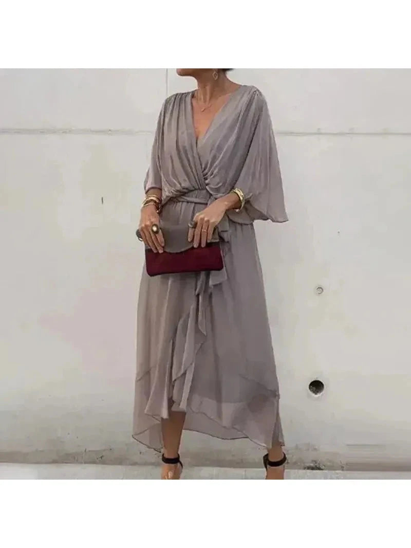 Black Remi elegant loose dress by Lumina Wear, featuring a flowing silhouette and stylish design, displayed on a hanger.
