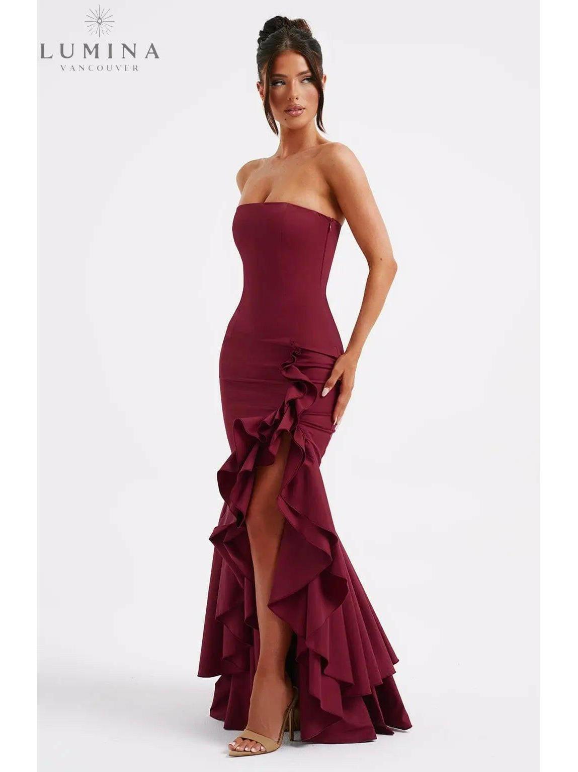 Blue floral sleeveless Riviera maxi dress with slit and ruffle details, perfect for wedding guest attire by Lumina Wear.